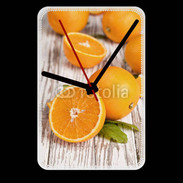 Grande pendule murale Belles oranges sur fond en bois