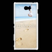 Coque Sony Xperia M2 Femme sautant face à la mer