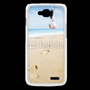 Coque LG L90 Femme sautant face à la mer