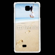 Coque LG F5 Femme sautant face à la mer