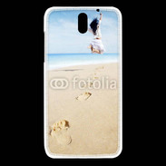 Coque HTC Desire 610 Femme sautant face à la mer