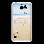Coque Huawei Y550 Femme sautant face à la mer