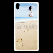Coque Sony Xperia Z5 Premium Femme sautant face à la mer